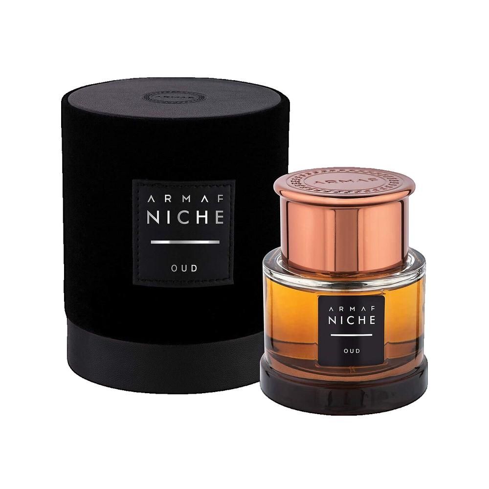 Flacone di profumo con contenitore in velluto nero. Scritta: Armaf Niche Oud. Flacone con coperchio ramato.