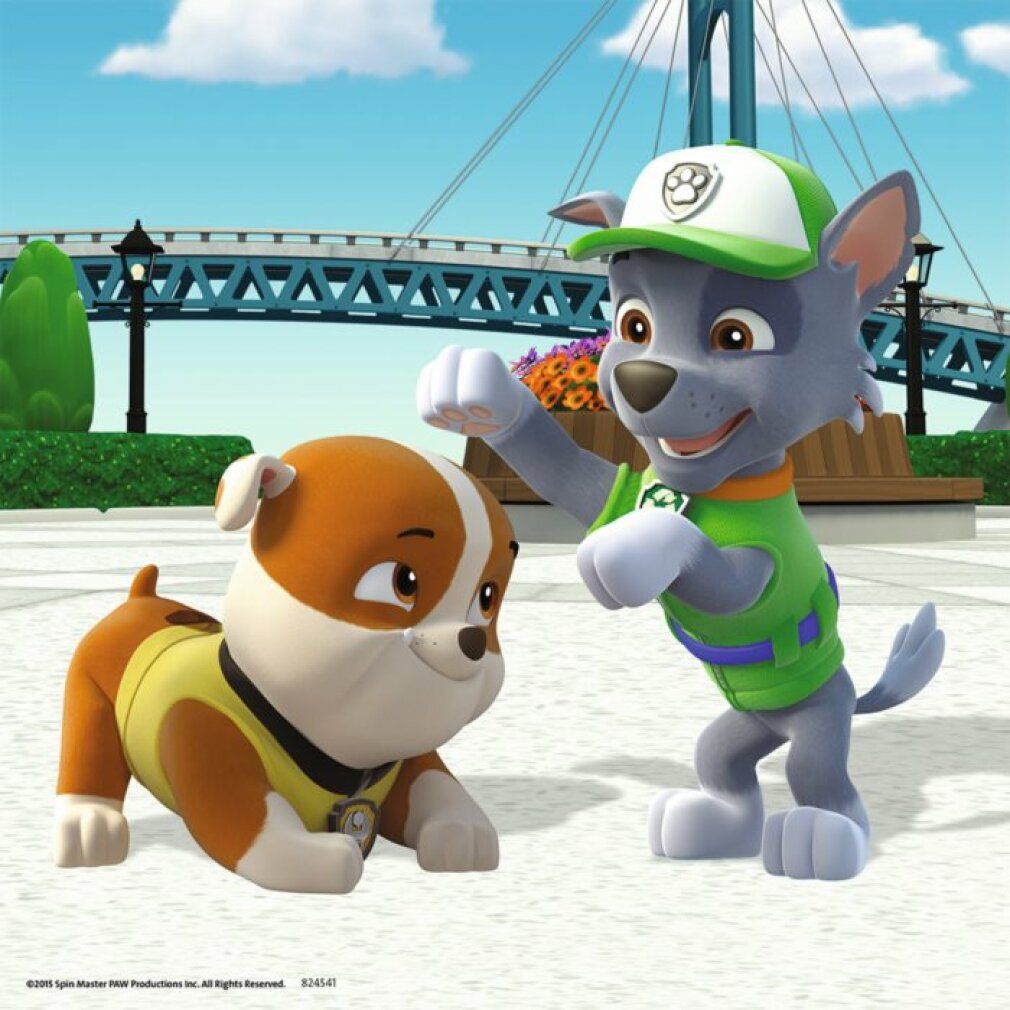 Due personaggi di Paw Patrol. Un cane in verde e uno in giallo. Entrambi indossano abiti. Sfondo: ponte e alberi.