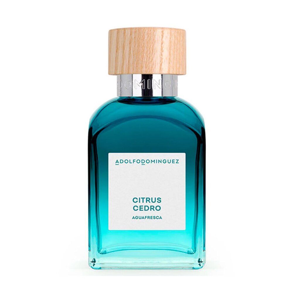 Flacone blu con tappo in legno. Scritta: Citrus Cedro, Agua Fresca. Marchio: Adolfo Dominguez.