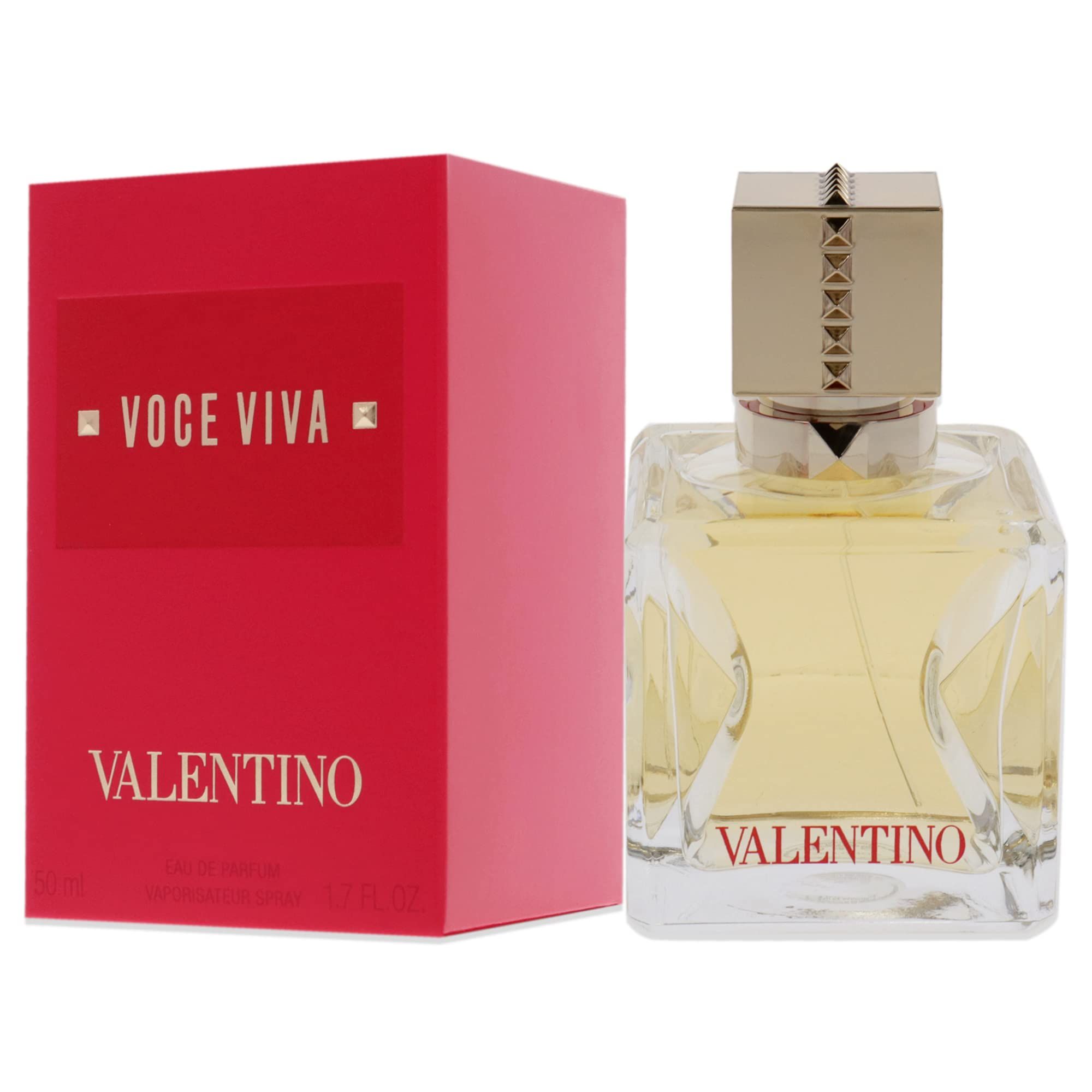 Scatola rossa e flacone di profumo. Flacone con tappo dorato e forma quadrata. Scritta "VALENTINO".