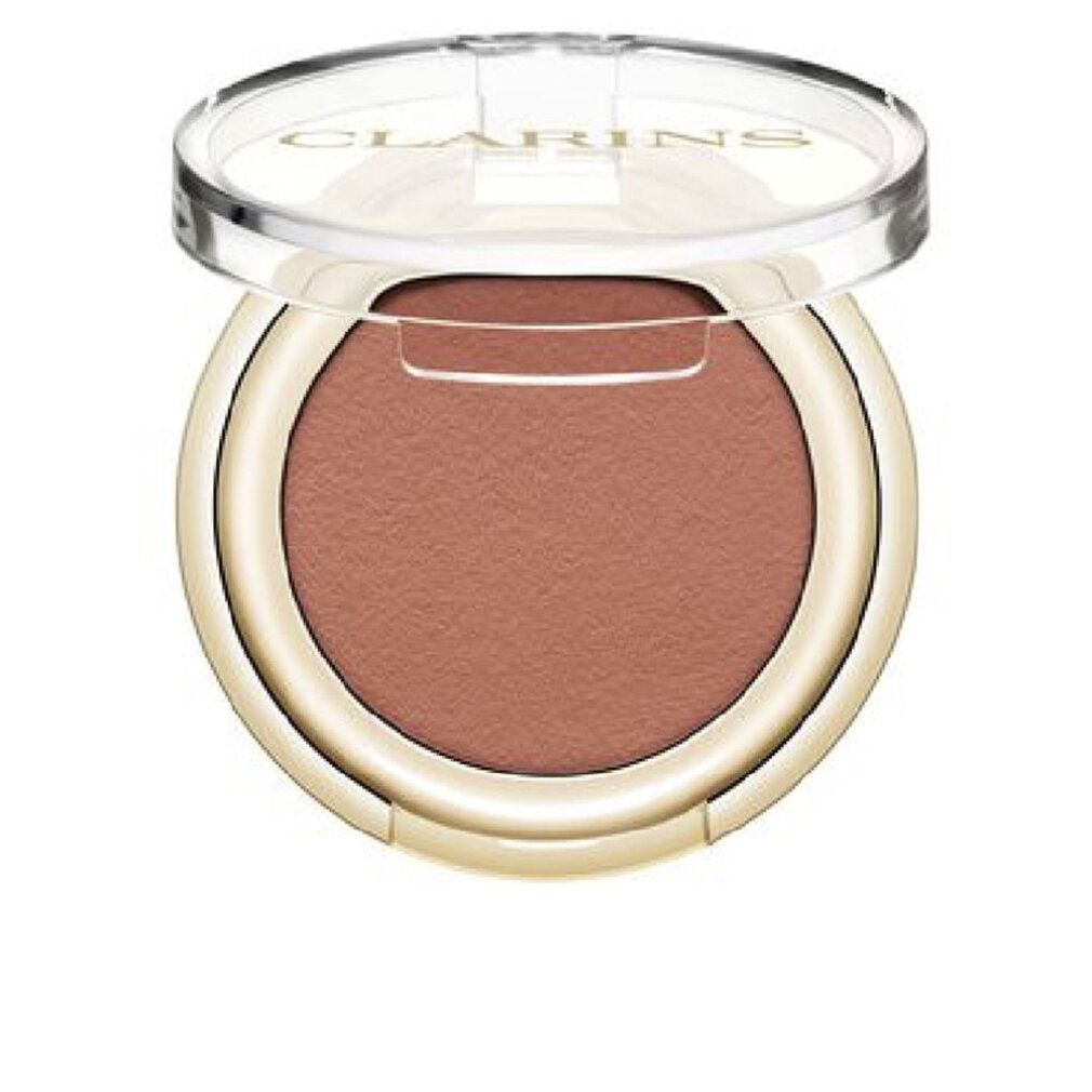 Contenitore rotondo di ombretto con ombretto rosa-marrone. Coperchio aperto. Bordo dorato. Coperchio trasparente con logo.