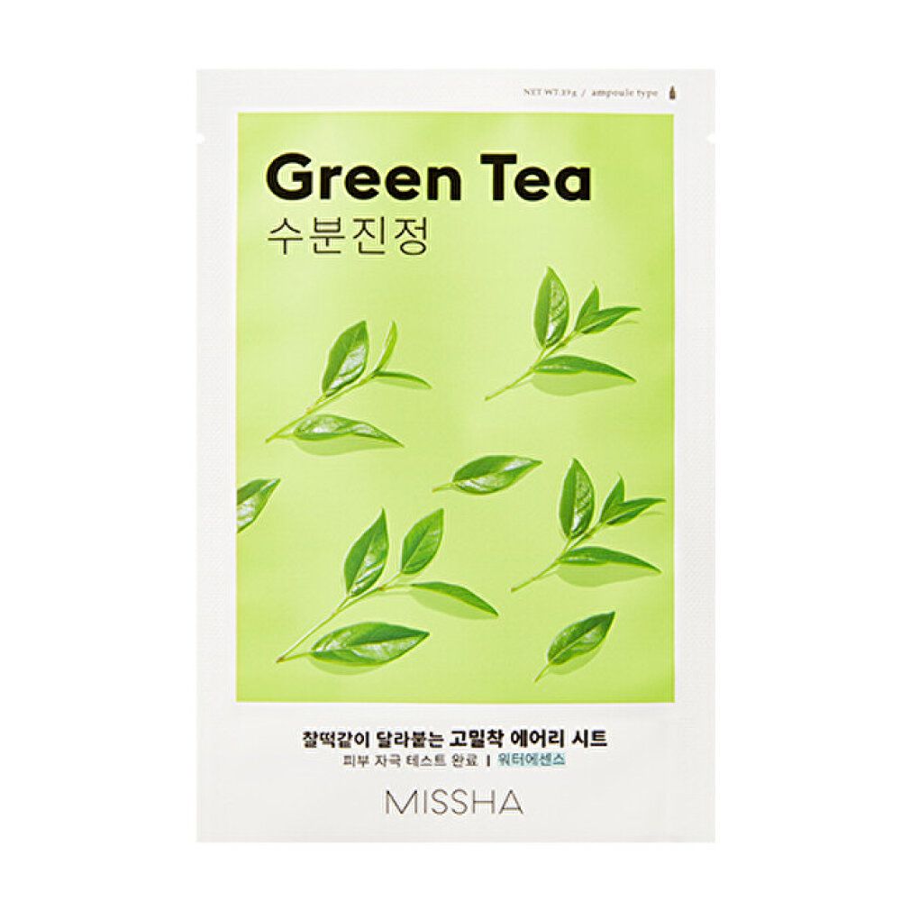 Confezione verde con foglie. Testo: Green Tea, MISSHA. Testo coreano.
