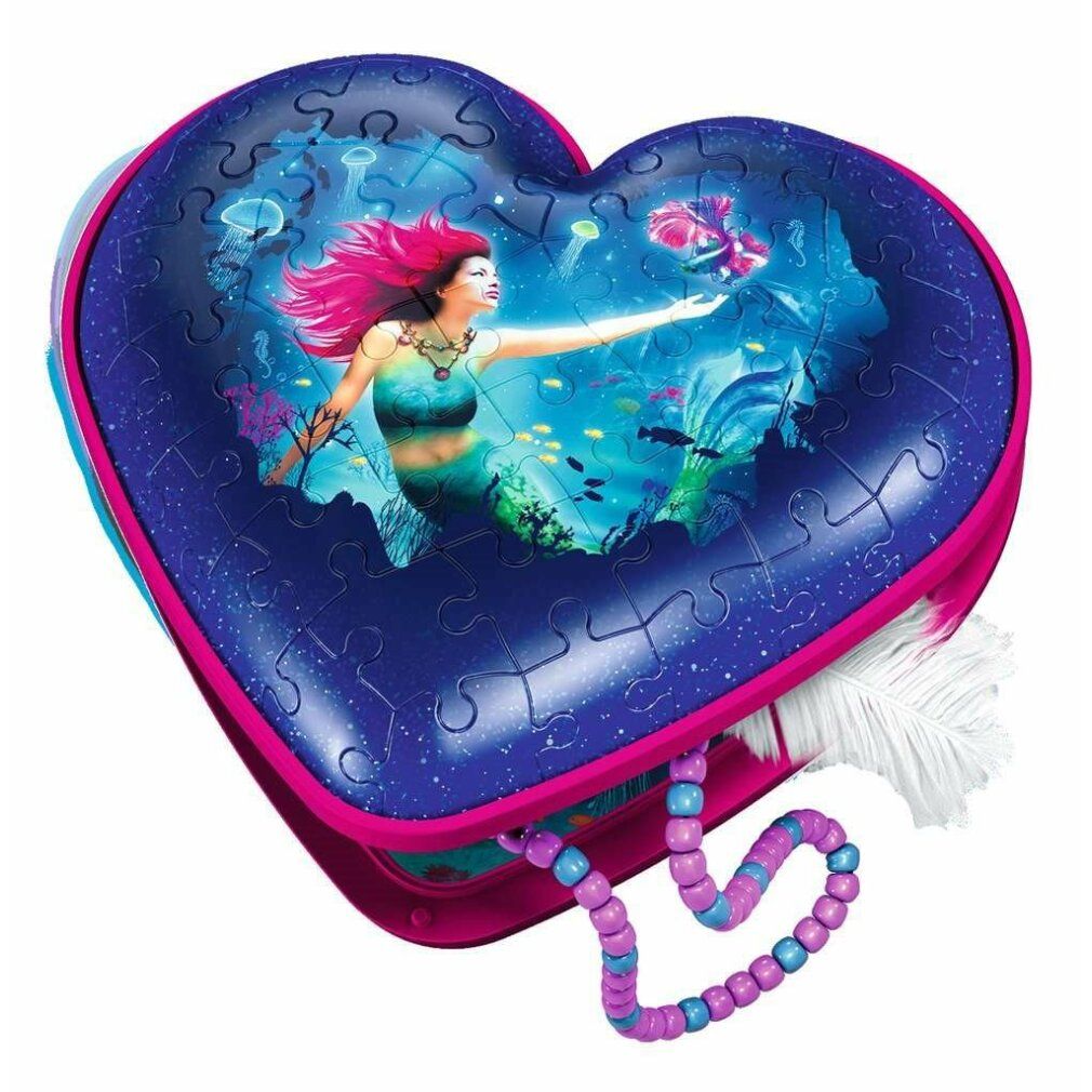 Puzzle 3D a forma di cuore con motivo sirena. Pezzi del puzzle visibili. Con catena. Marca: Ravensburger.