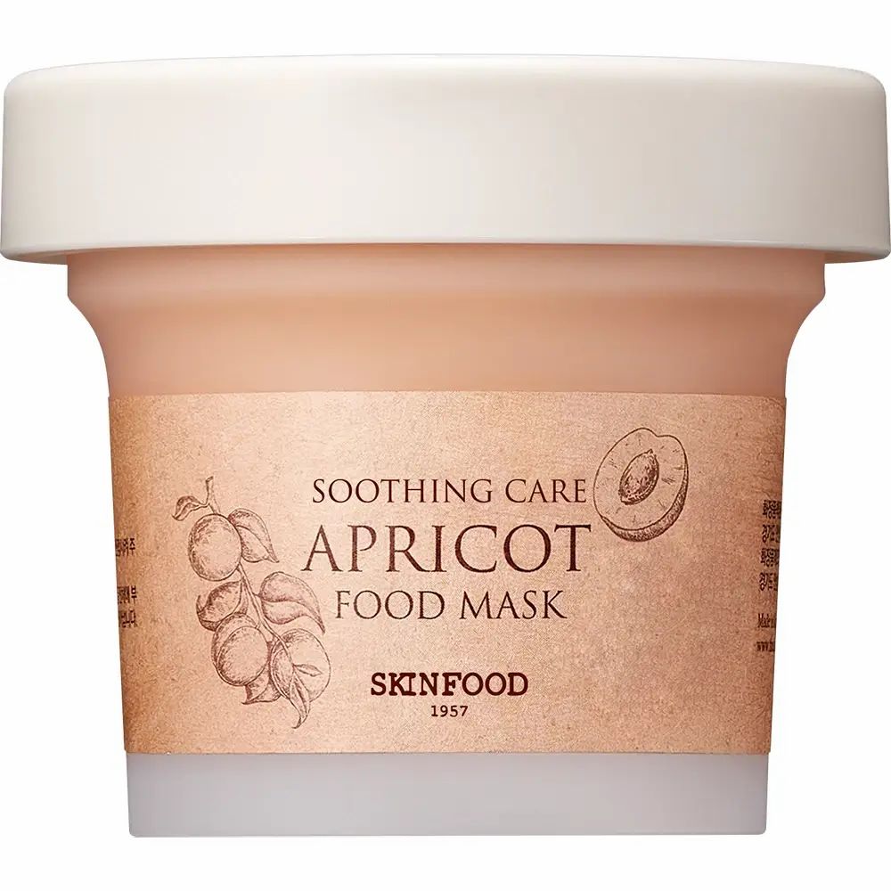 Maschera beige in vasetto con coperchio bianco. Scritta: APRICOT FOOD MASK. Marchio: SKINFOOD.
