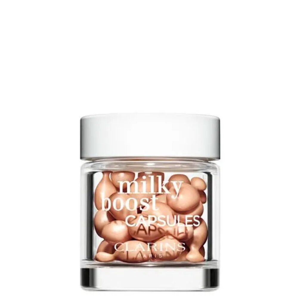 Vasetto di vetro con Clarins Milky Boost Capsules. Capsule visibili.