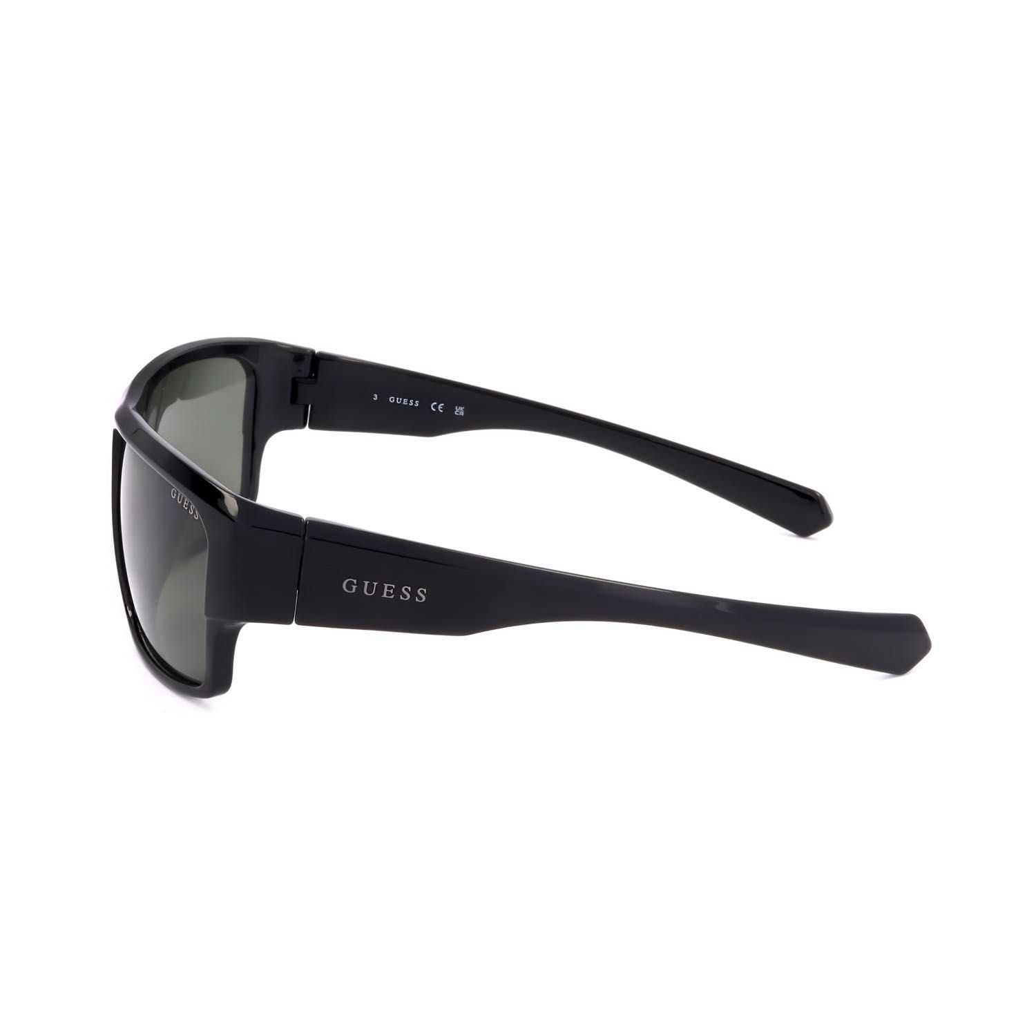 Occhiali da sole Guess neri con lenti scure e logo argentato sul
montante.