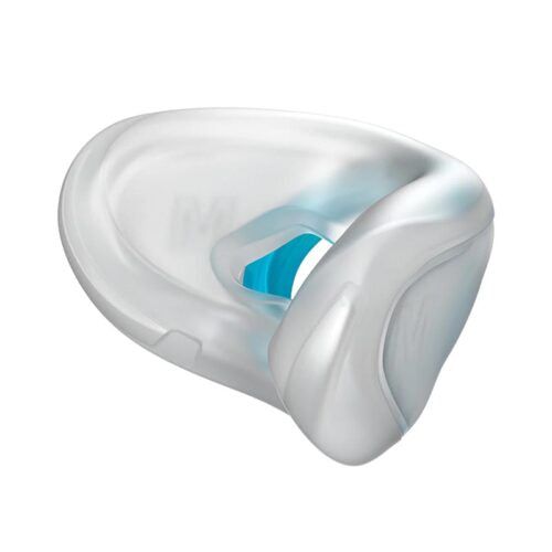 Vista in diagonale del cuscino maschera bianco in silicone con inserto blu.