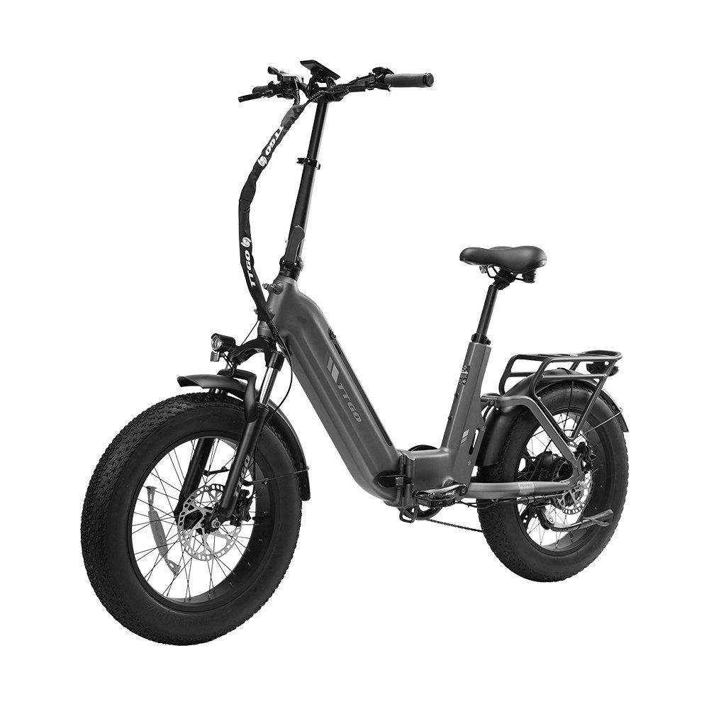 E-bike pieghevole grigia con pneumatici neri e dettagli arancioni. Dotata di portapacchi e freni a disco idraulici.