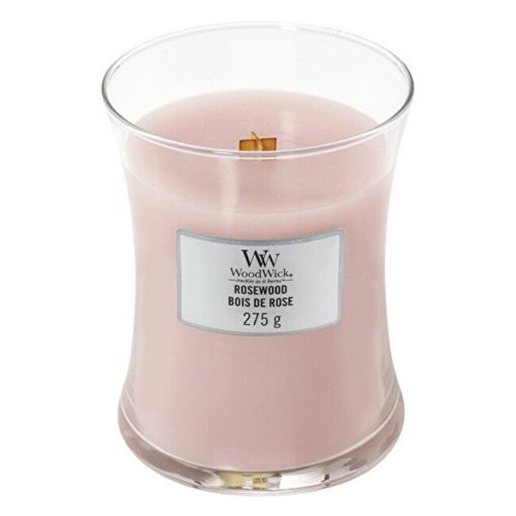 Candela a clessidra con stoppino in legno. Cera rosa, etichetta con logo, testo e 275g. Profumo Rosewood.