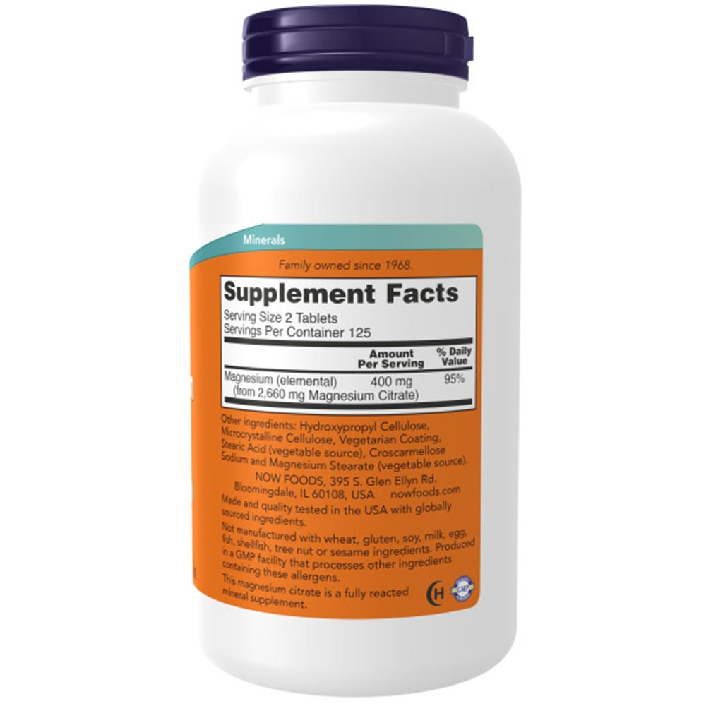 Flacone bianco con tappo blu. Etichetta arancione con "Supplement Facts" e informazioni. Logo "NOW FOODS" visibile.