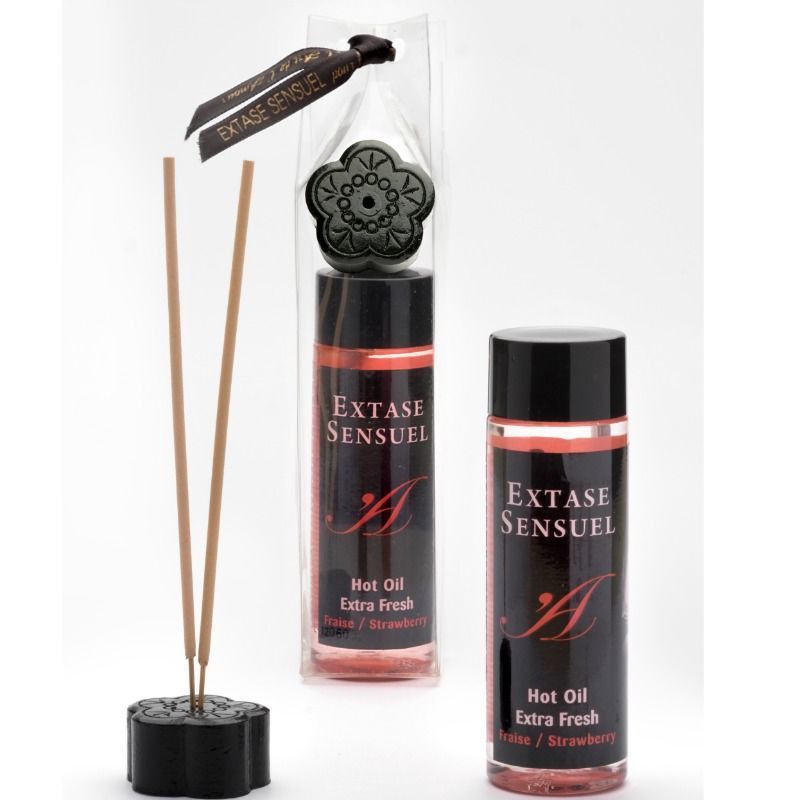 Due flaconi di Extase Sensuel Hot Oil Extra Fresh Fragola e un supporto con bastoncini d'incenso.