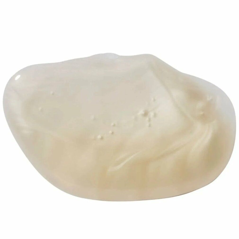Primo piano di una texture gel shampoo color crema. Massa lucida, leggermente trasparente.