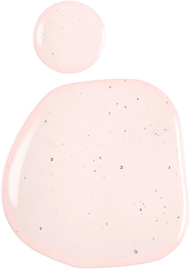 Due gocce di liquido rosa su sfondo bianco. Una goccia grande e una più piccola.