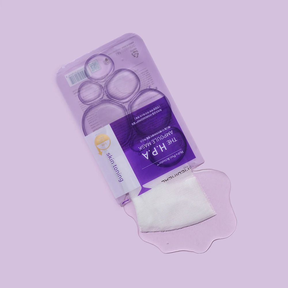 Confezione aperta MEDIHEAL H.P.A Glowing Ampoule Mask. Maschera e liquido su sfondo viola. Testo: Skin Toning.