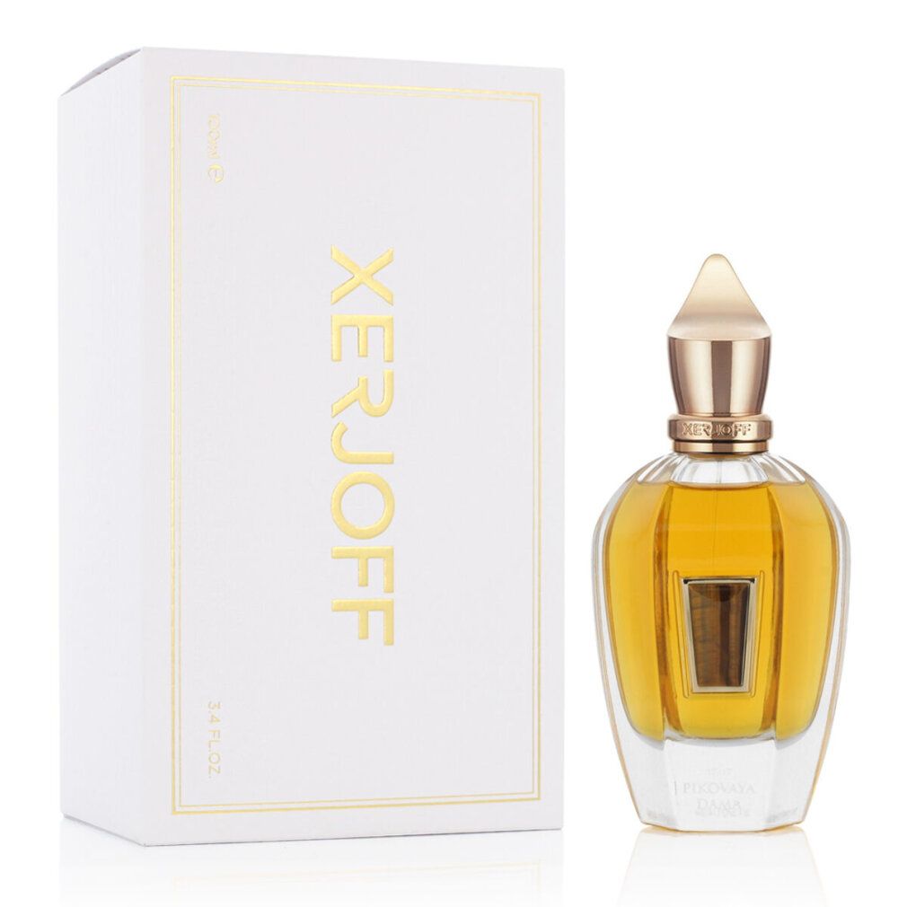 Flacone di profumo e confezione. Flacone con tappo dorato e contenuto dorato. Confezione bianca con scritta dorata.