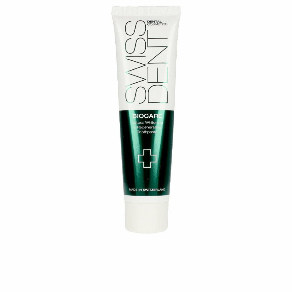 Tubo di dentifricio bianco e verde. Scritte: SWISSDENT, BIOCARE, Natural Whitening, dentifricio. Simbolo croce verde.