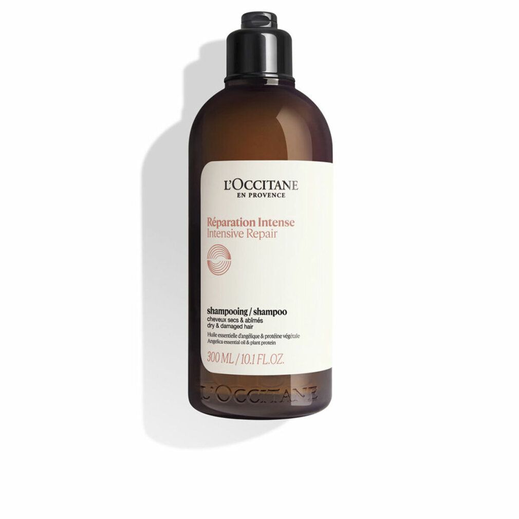 Flacone di shampoo marrone con tappo nero. Etichetta con nome e testo del prodotto. L'OCCITANE Shampoo Riparatore Intensivo 300 ml.
