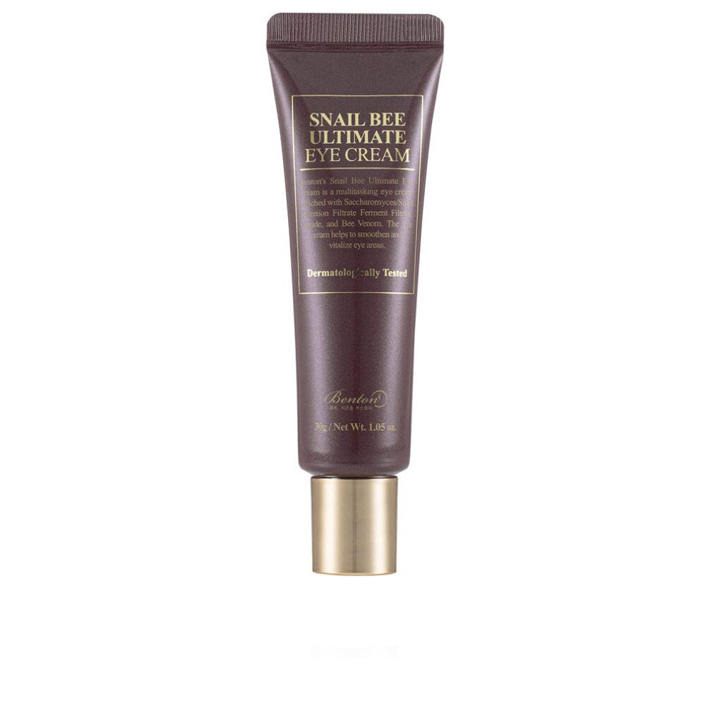 Tubo marrone con tappo dorato. Scritta: Snail Bee Ultimate Eye Cream. Testo e logo. Dermatologicamente testato.