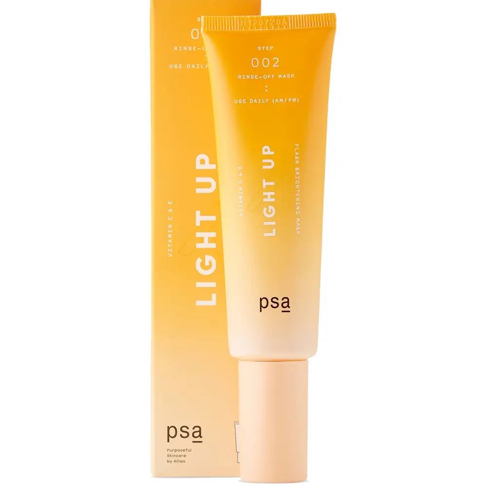 Maschera illuminante alla vitamina C PSA Light Up accanto alla sua confezione arancione.