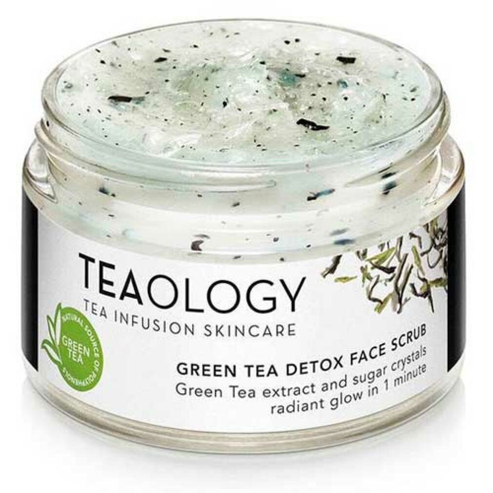 Vasetto di scrub viso verde. Scritto: Teaology, Green Tea Detox Face Scrub. Contiene cristalli di zucchero.