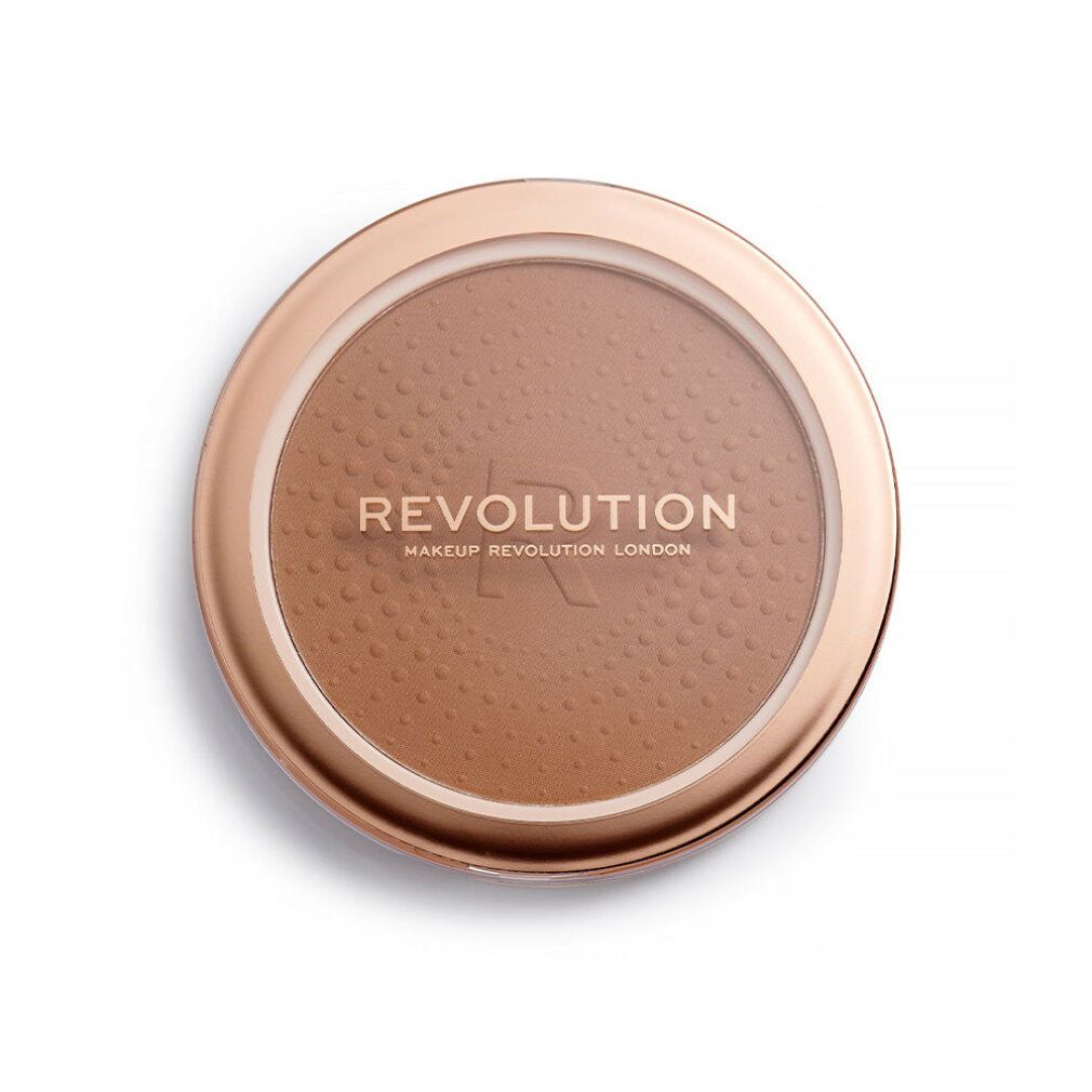 Bronzer rotondo in un contenitore dorato. Scritta REVOLUTION. Superficie puntinata.