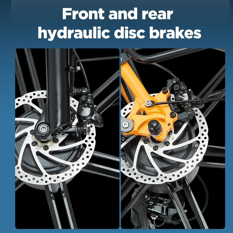 Freni a disco idraulici anteriori e posteriori. Dischi freno argentati, pinze nere, telaio giallo.