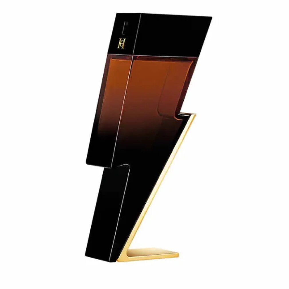 Flacone nero a forma di fulmine, base dorata. Liquido marrone visibile. Logo in alto. Angolo di ripresa obliquo.