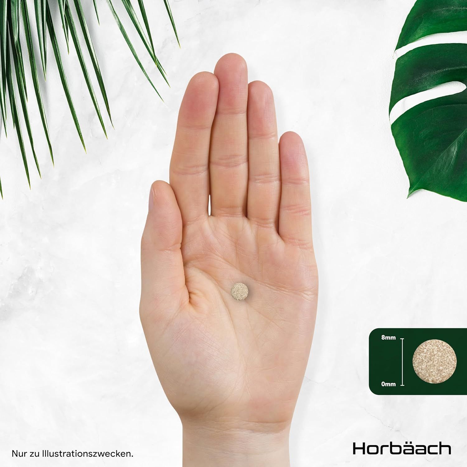 Mano che tiene una compressa. La compressa è rotonda e beige. Dimensioni: 8 mm di diametro, 0 mm di spessore.