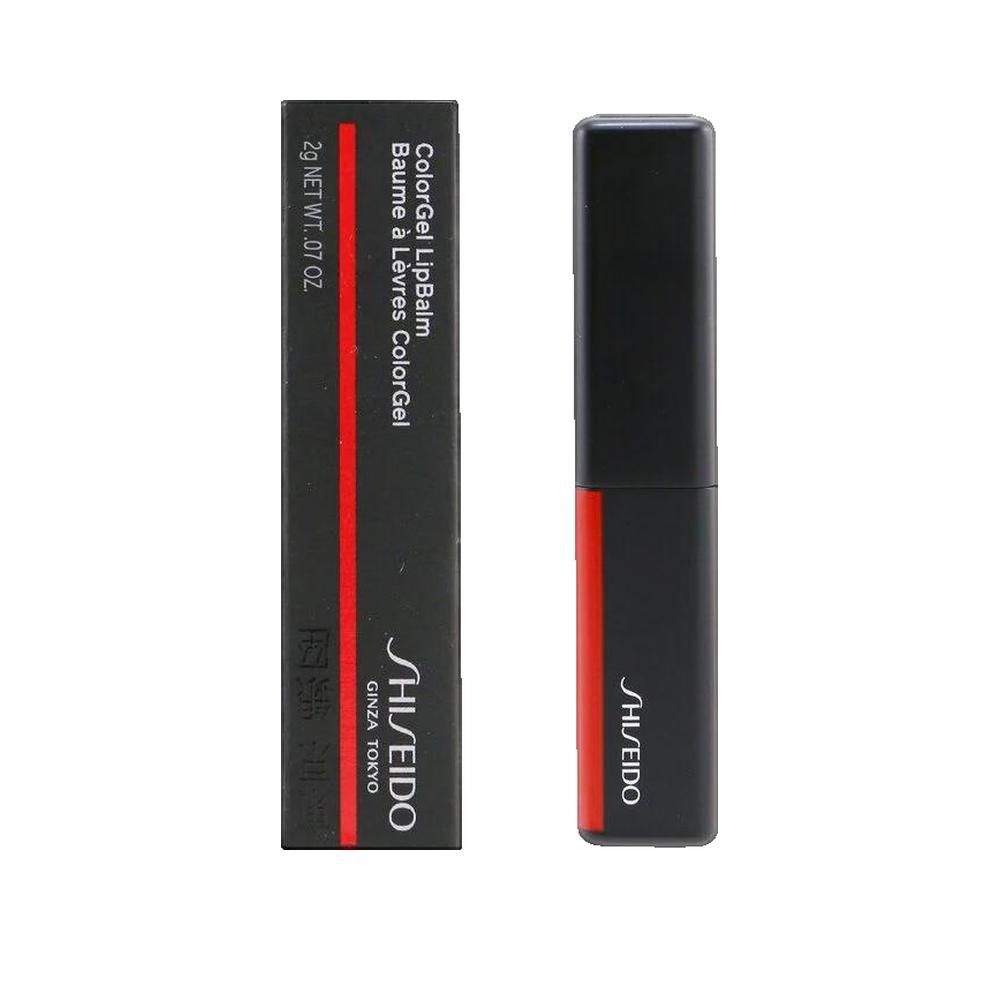 Confezione e balsamo labbra neri. Confezione con striscia rossa e testo. Balsamo labbra con striscia rossa. Marchio Shiseido.