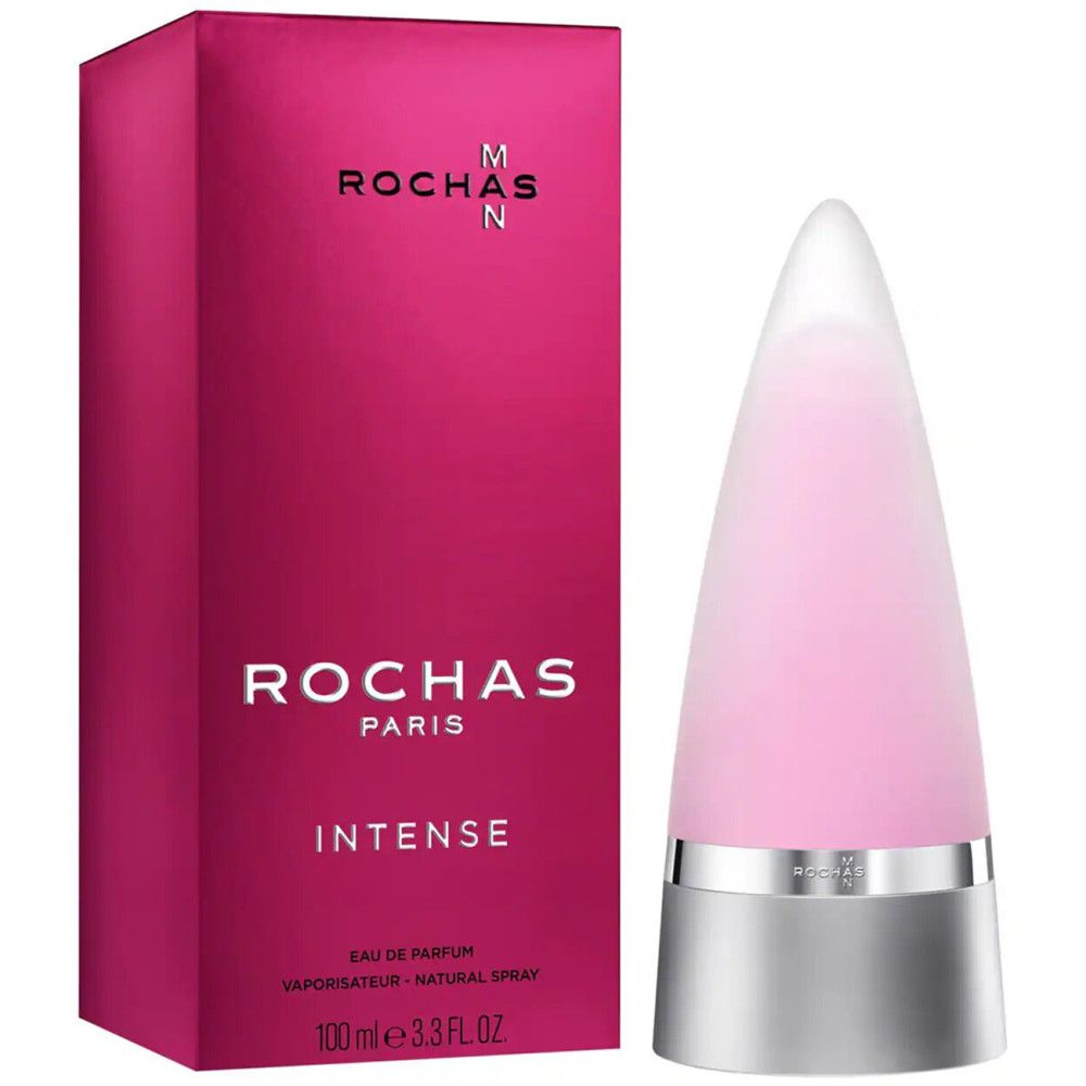 Flacone rosa con base e tappo argentati, accanto a una scatola rosa con testo bianco. Scritta: Rochas Paris Intense.