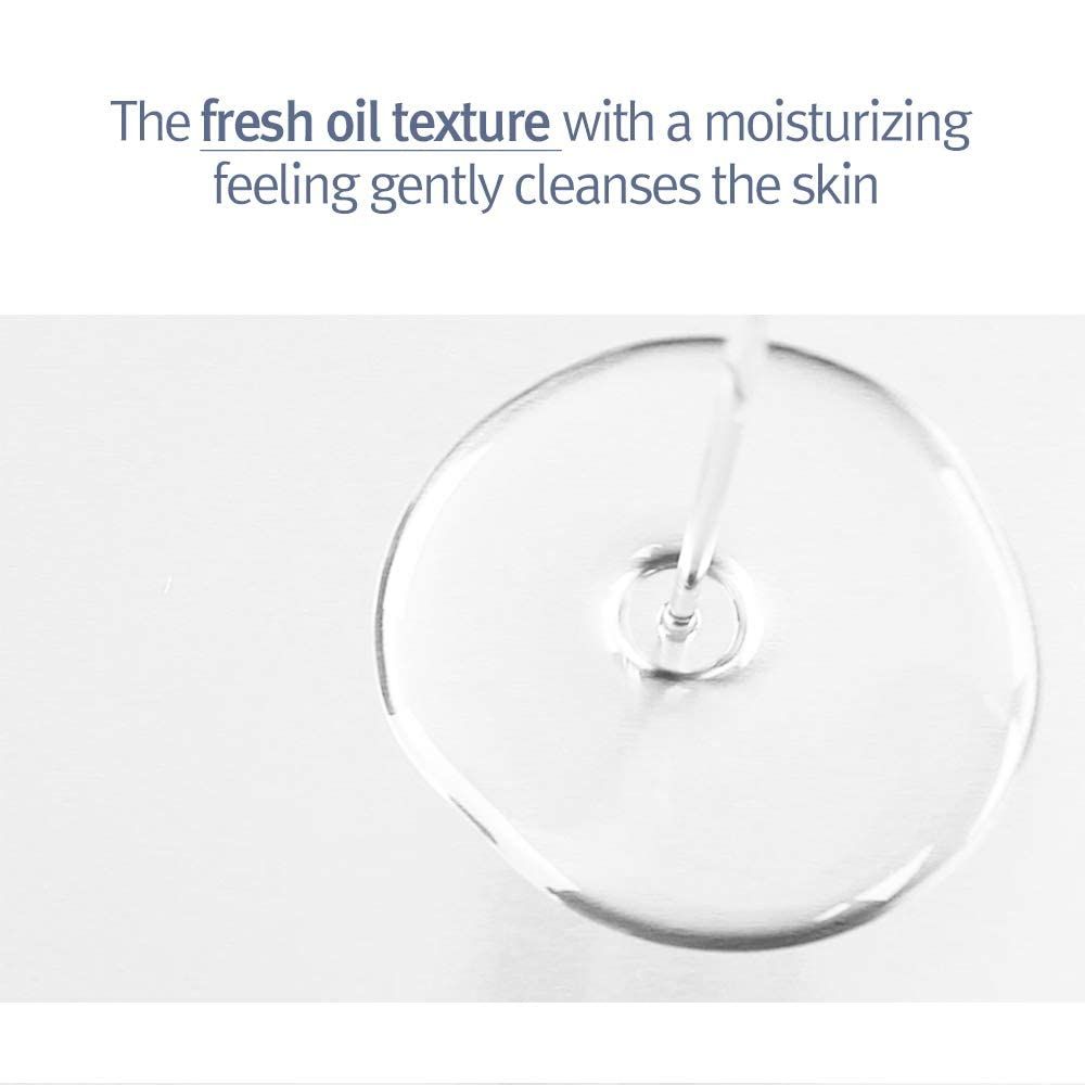 Primo piano dell'olio. Testo: texture oleosa che deterge e idrata delicatamente la pelle.