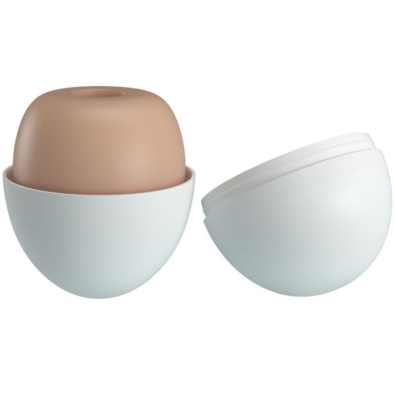 Metà uovo masturbatore beige in un guscio bianco aperto. Il guscio è diviso in due.