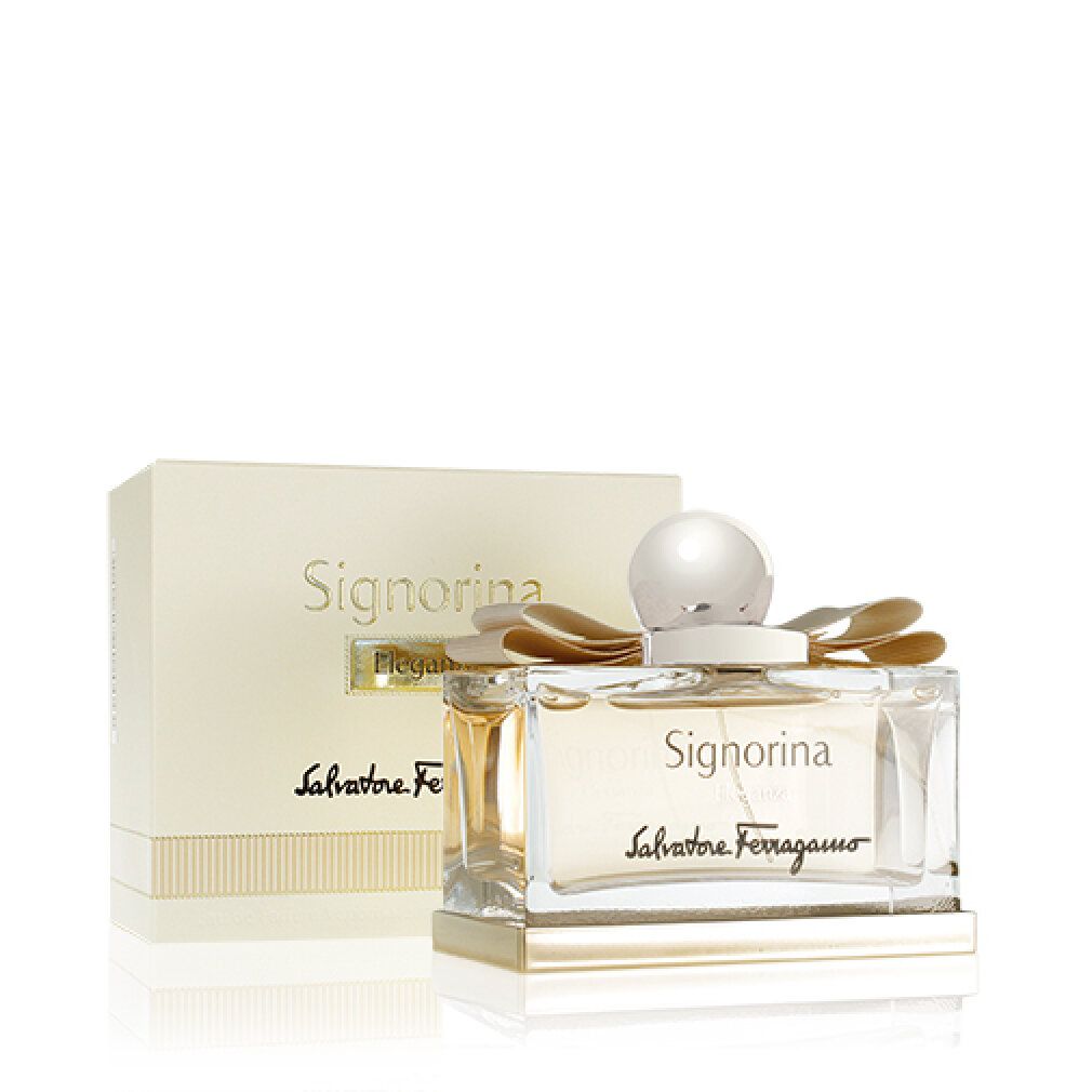Flacone di profumo Signorina Eleganza con confezione. Flacone rettangolare in vetro con tappo dorato e fiocco. Scritta Signorina Eleganza e Salvatore Ferragamo.