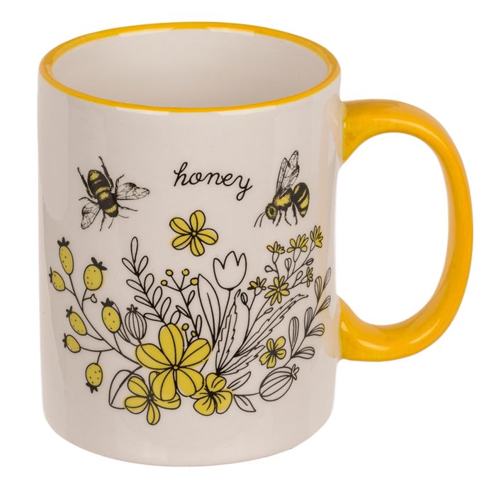 Tazza in ceramica con manico giallo, motivo api e fiori. Scritta 'honey'. Bordo giallo.