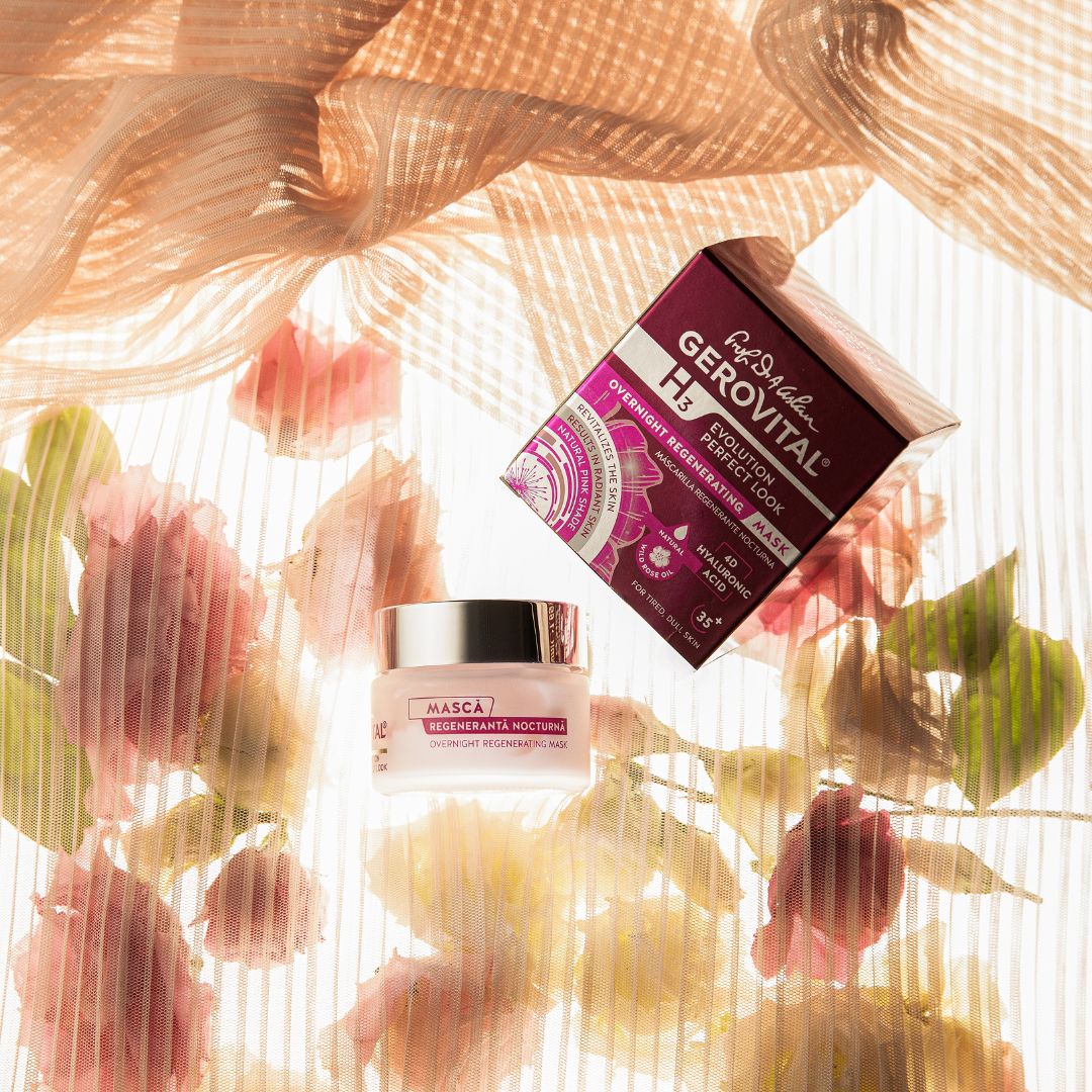 Vasetto di crema e scatola su sfondo floreale. Scritta: Gerovital H3 Evolution Perfect Look. Masca Regeneranta.