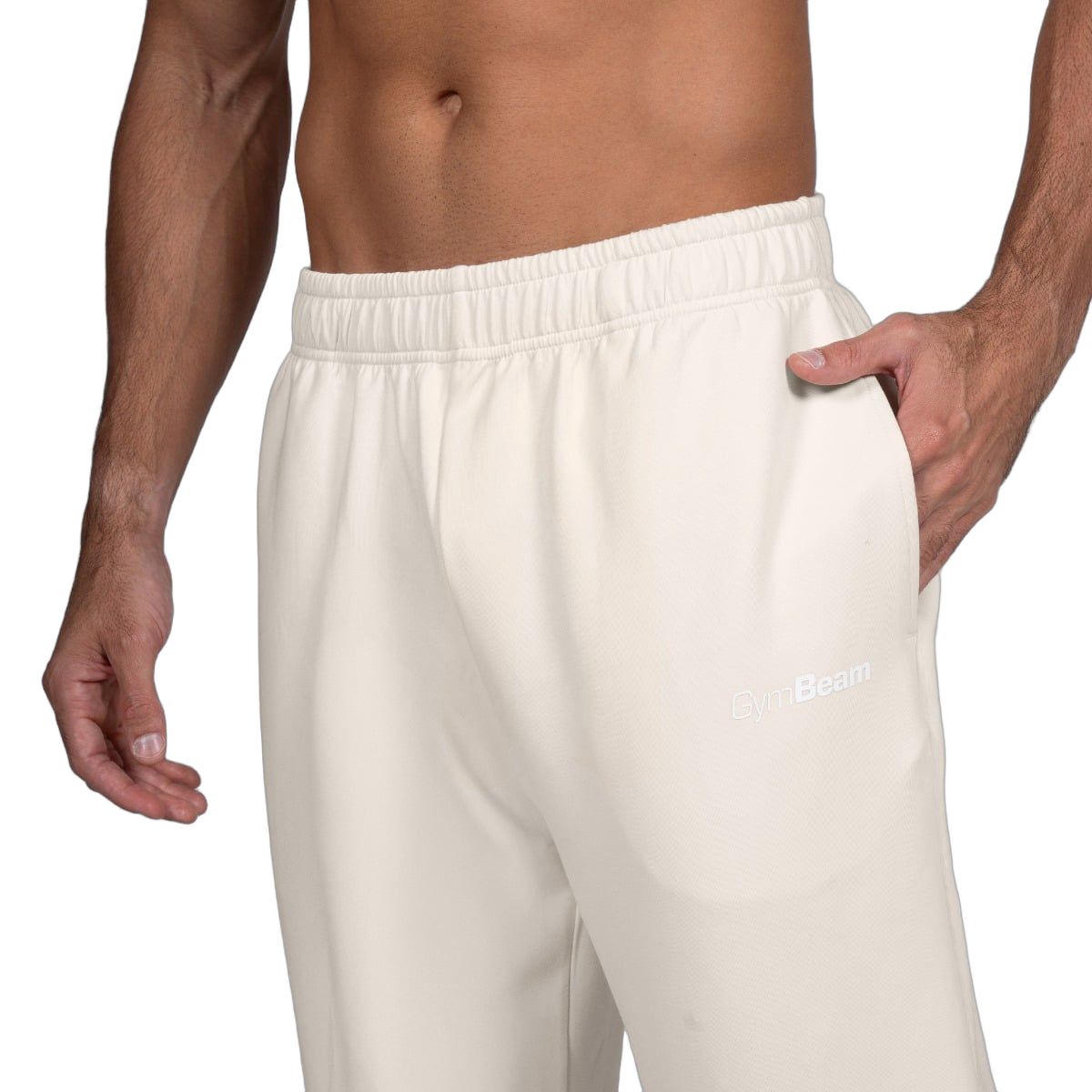 Vista dettagliata dei pantaloni da jogging da uomo: elastico in vita e tasche laterali.