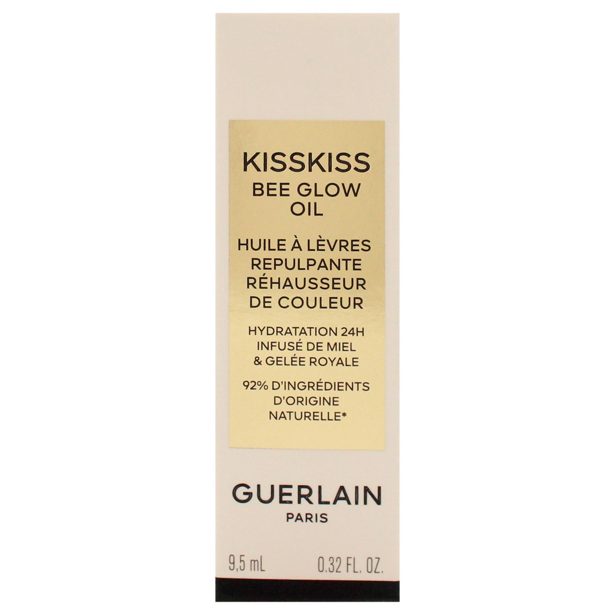 Confezione con testo. Sono visibili "KISSKISS BEE GLOW OIL" e "GUERLAIN". Contiene il 92% di ingredienti naturali.