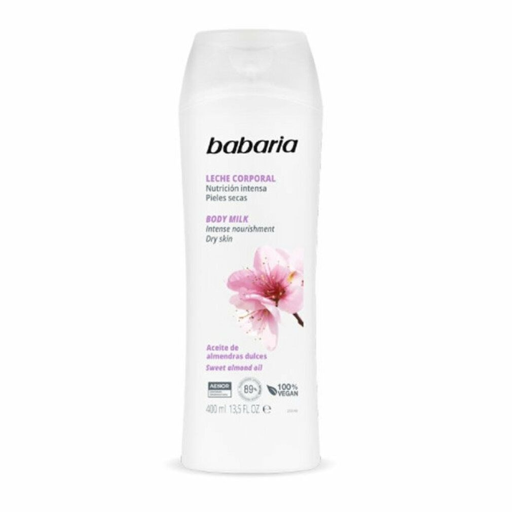 Flacone bianco Babaria Body Milk. Scritta: Leche Corporal, Nutrición intensa, Pieles secas, Body Milk, Intense nourishment, Dry skin. Fiore di mandorlo.