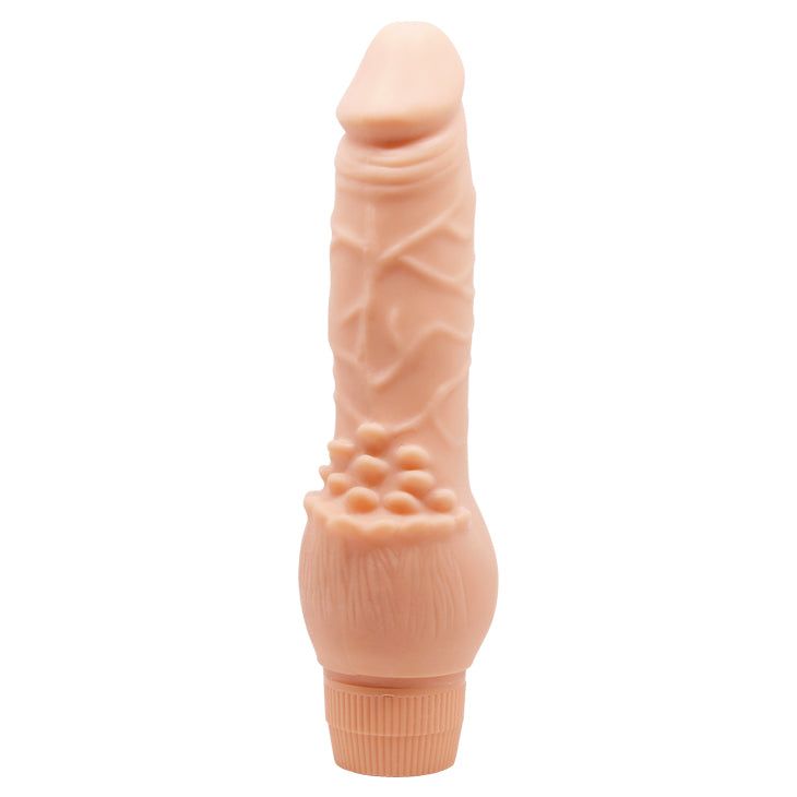 Vibratore realistico beige, base scanalata, superficie dettagliata. Scanalature verticali e protuberanze visibili.