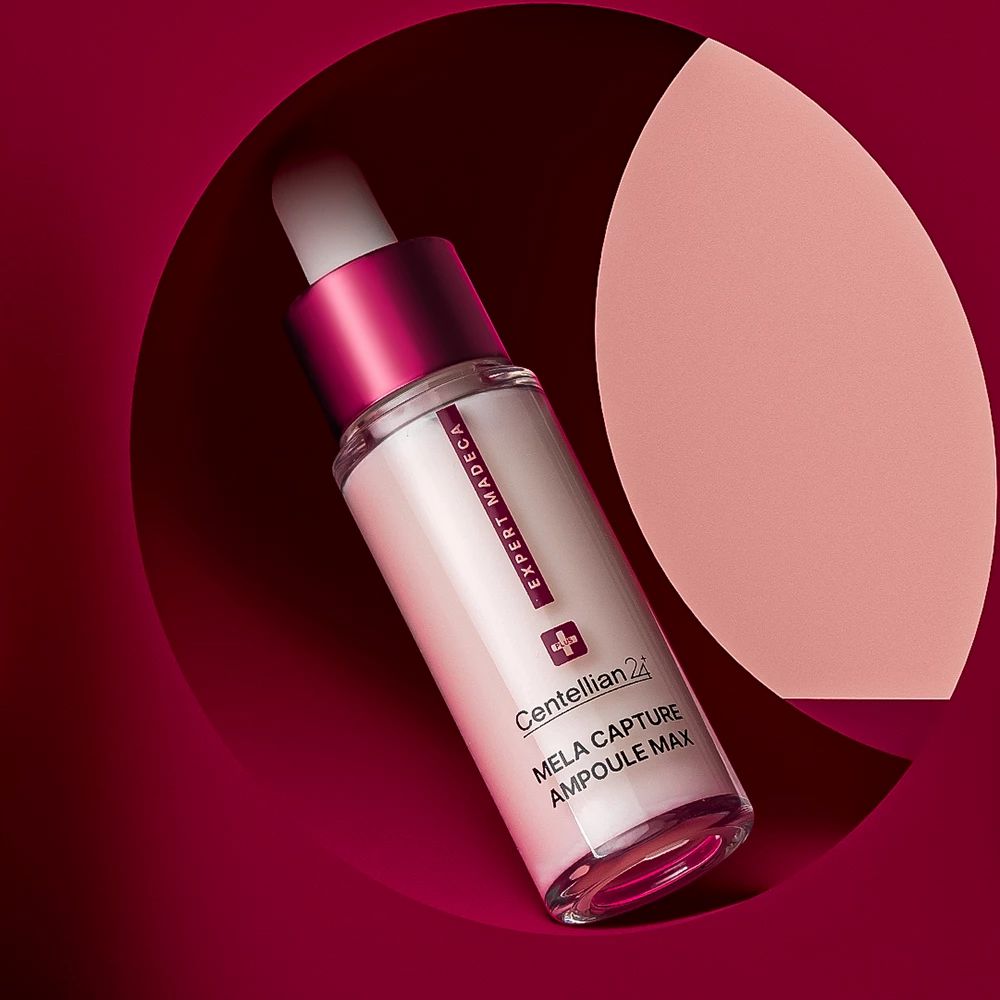 Flacone di siero con contagocce. Siero bianco, tappo rosso, nome del marchio e del prodotto visibili.