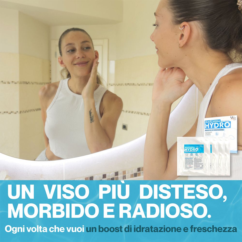 Donna con maschera viso allo specchio. Scritta blu: UN VISO PIÙ DISTESO, MORBIDO E RADIOSO. Confezione di maschere.