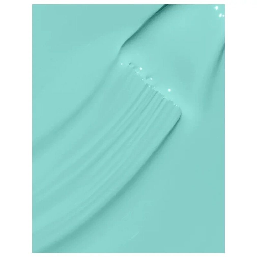 Primo piano di smalto turchese con pennello. Superficie lucida.