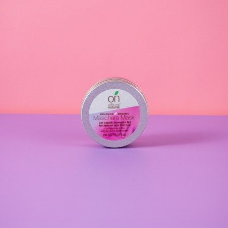 Barattolo rotondo con coperchio. Scritta: Officina Naturae, Maschera Mask per capelli normali e fini. Etichetta rosa. Sfondo rosa e viola.