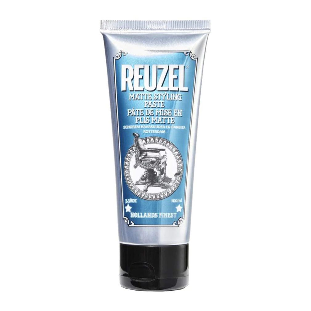 Tubo d'argento con etichetta blu. Testo: REUZEL, Matte Styling Paste. Immagine di una poltrona da barbiere. 100ml. Prodotto olandese.