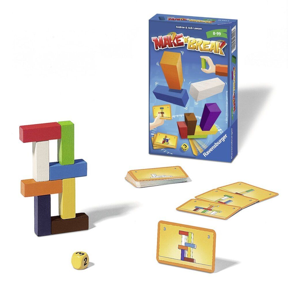 Gioco Make 'n' Break con blocchi, carte e dado. Alcuni blocchi impilati in una torre. La scatola del gioco è sullo sfondo.
