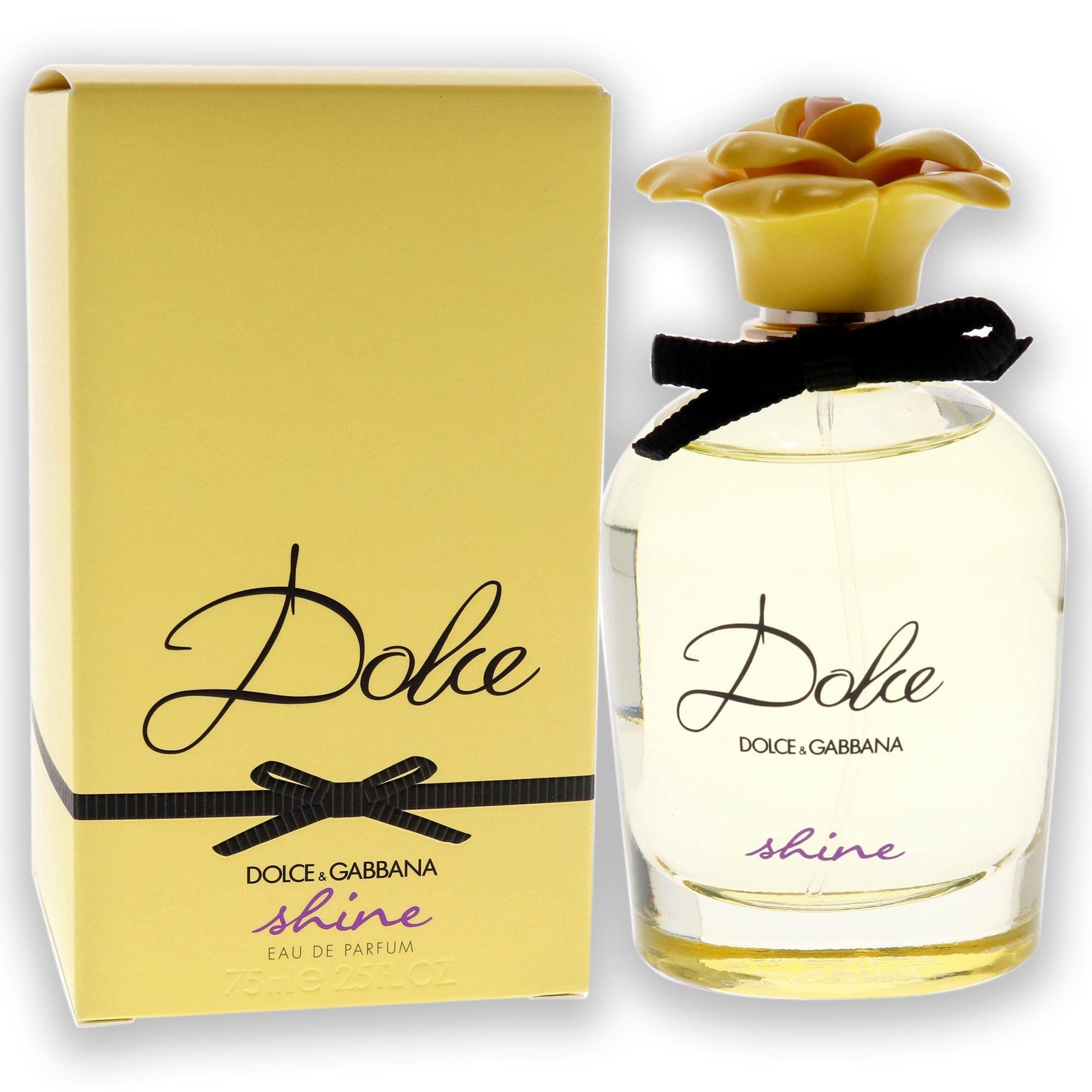 Flacone di profumo e confezione. Confezione gialla con fiocco nero e scritta "Dolce & Gabbana Dolce shine".