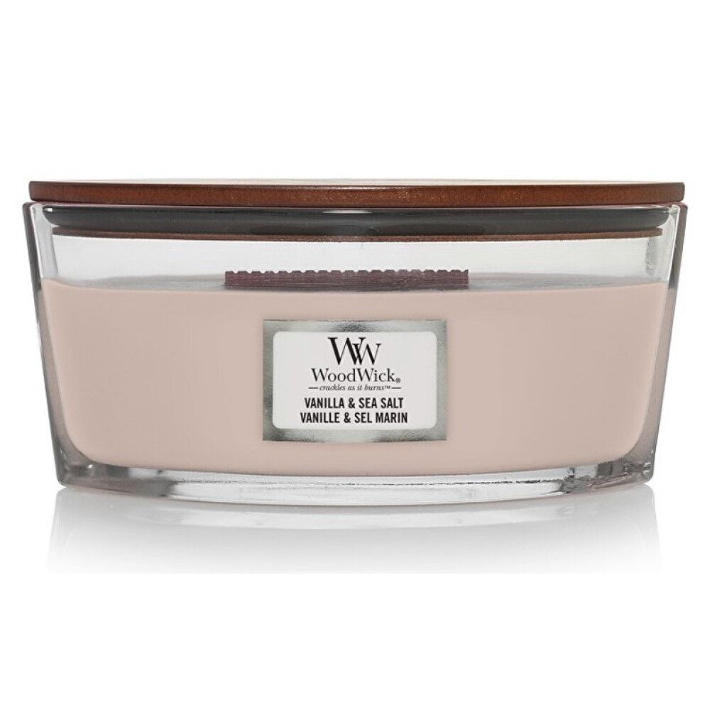 Candela ellittica con coperchio. Contenitore in vetro con cera rosa. Adesivo con marchio e nome del prodotto.