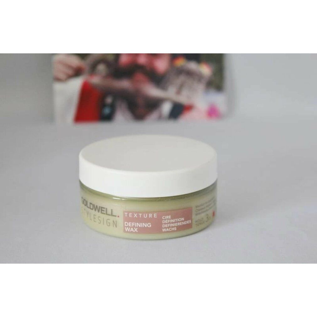Goldwell Stylesign Texture Defining Wax in un vasetto rotondo con coperchio bianco.