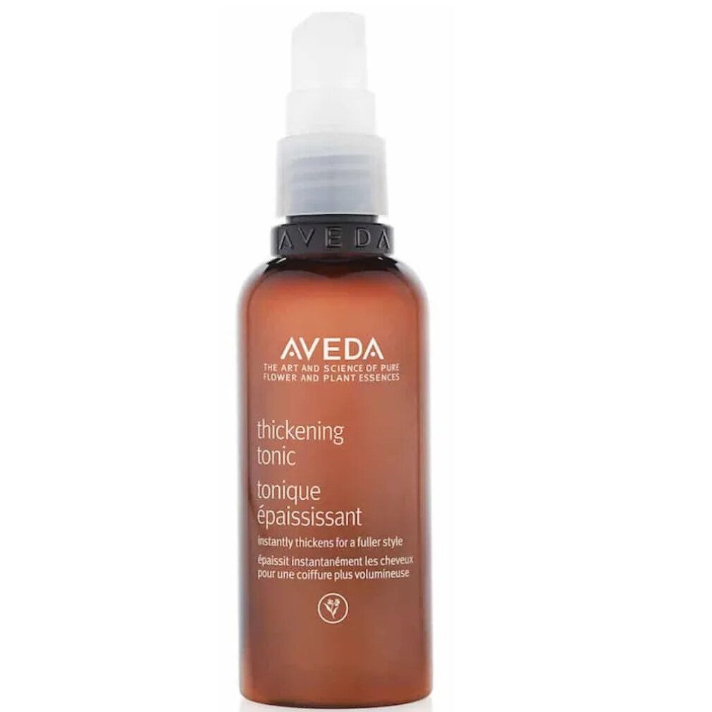 Flacone marrone con vaporizzatore bianco. Scritta: Aveda, thickening tonic, tonique épaississant. Logo vegano.
