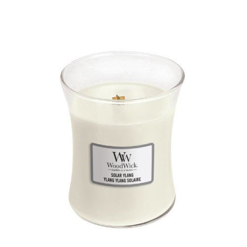 Candela a clessidra senza coperchio. Etichetta "WoodWick" e "Solar Ylang".